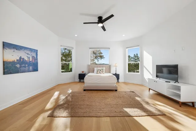 a living room with furniture window and wooden floor