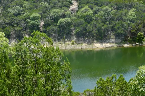 a view of a lake with a yard