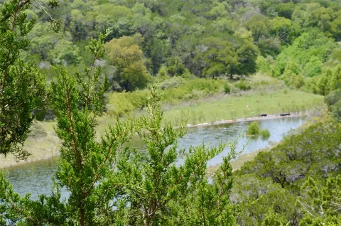 a view of a lake with a yard