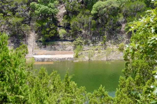 a view of a lake with a yard