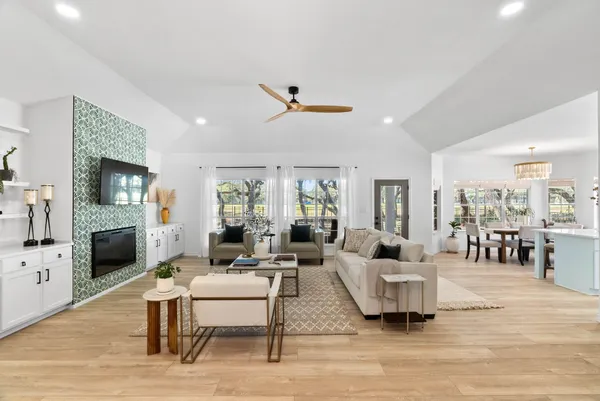 a living room with furniture and wooden floor
