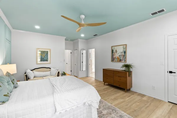 a bedroom with a bed and a dresser