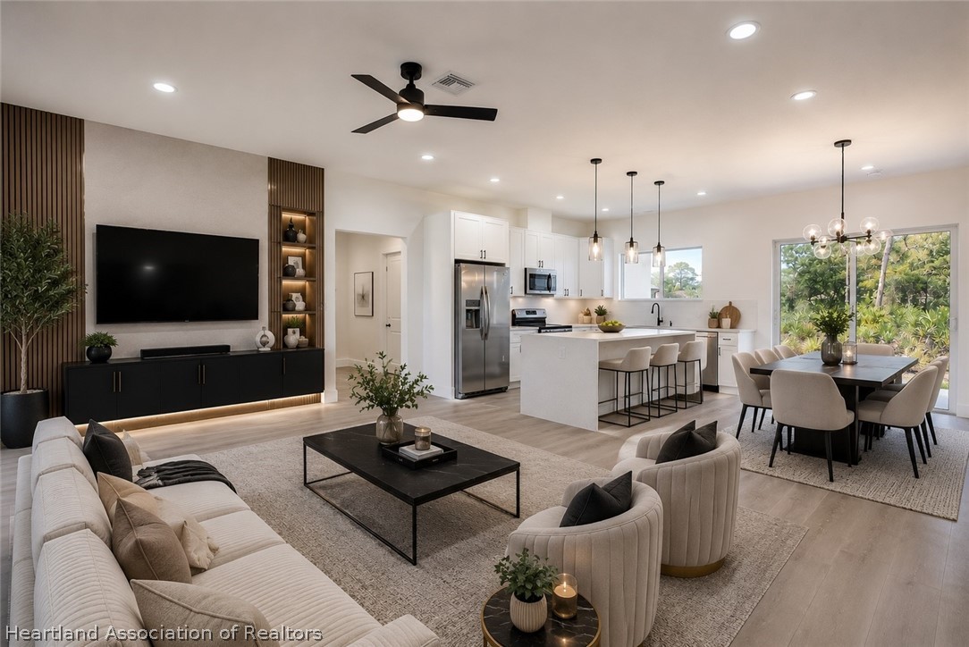 4307 Talbot Street Sebring, FL 33872 - Photo 2 of 19 a living room with furniture and a flat screen tv