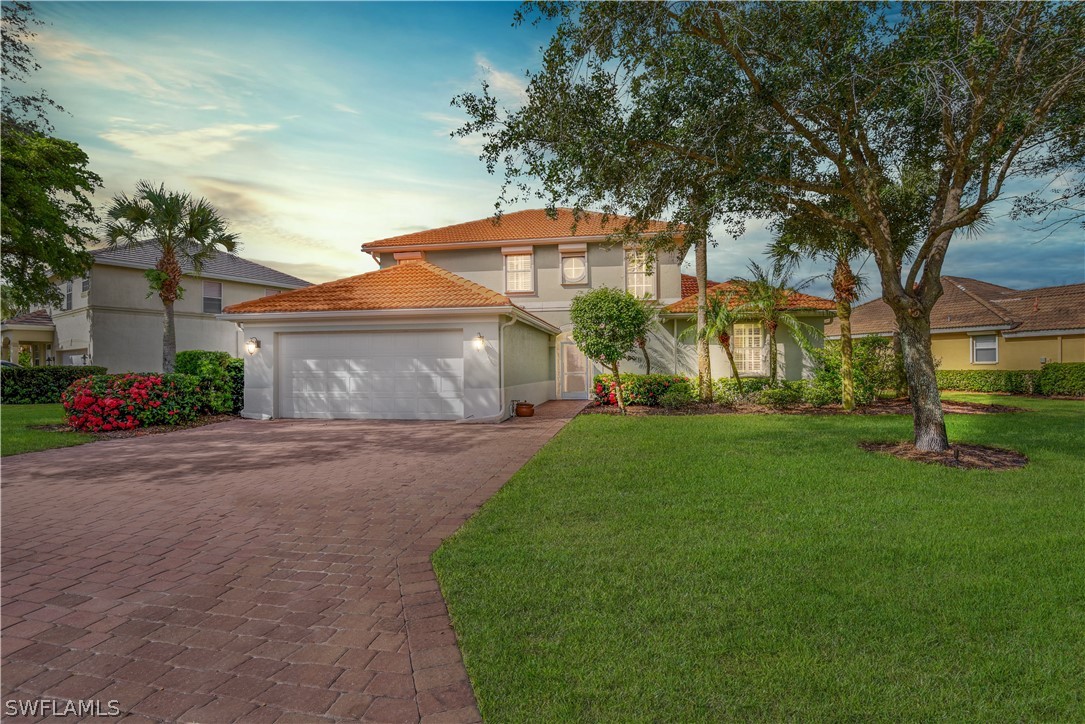 12834 Timber Ridge Drive Fort Myers, FL 33913 - Photo 1 of 31 front view of a house with a yard