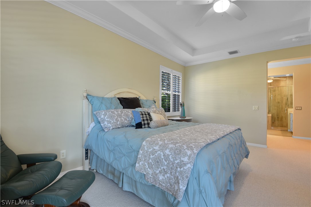 12834 Timber Ridge Drive Fort Myers, FL 33913 - Photo 13 of 31 a bedroom with a bed and a couch