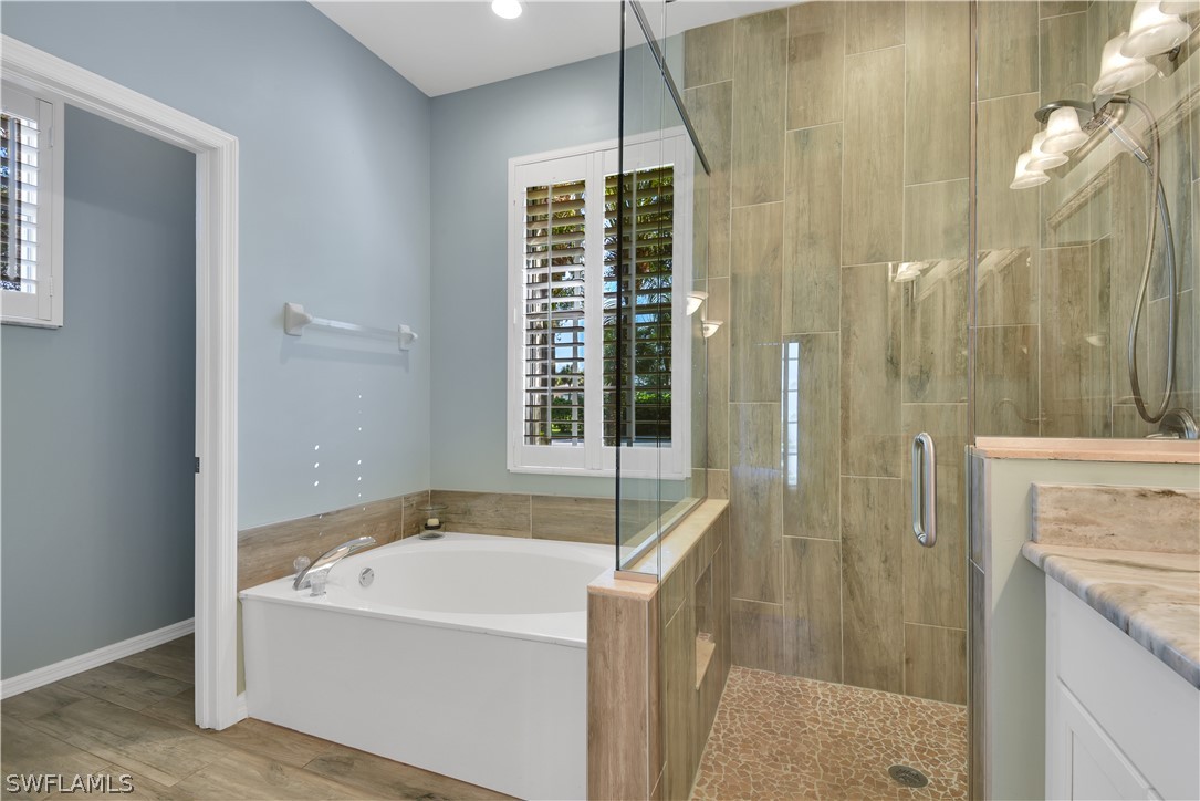12834 Timber Ridge Drive Fort Myers, FL 33913 - Photo 15 of 31 a bathroom with a bathtub and shower