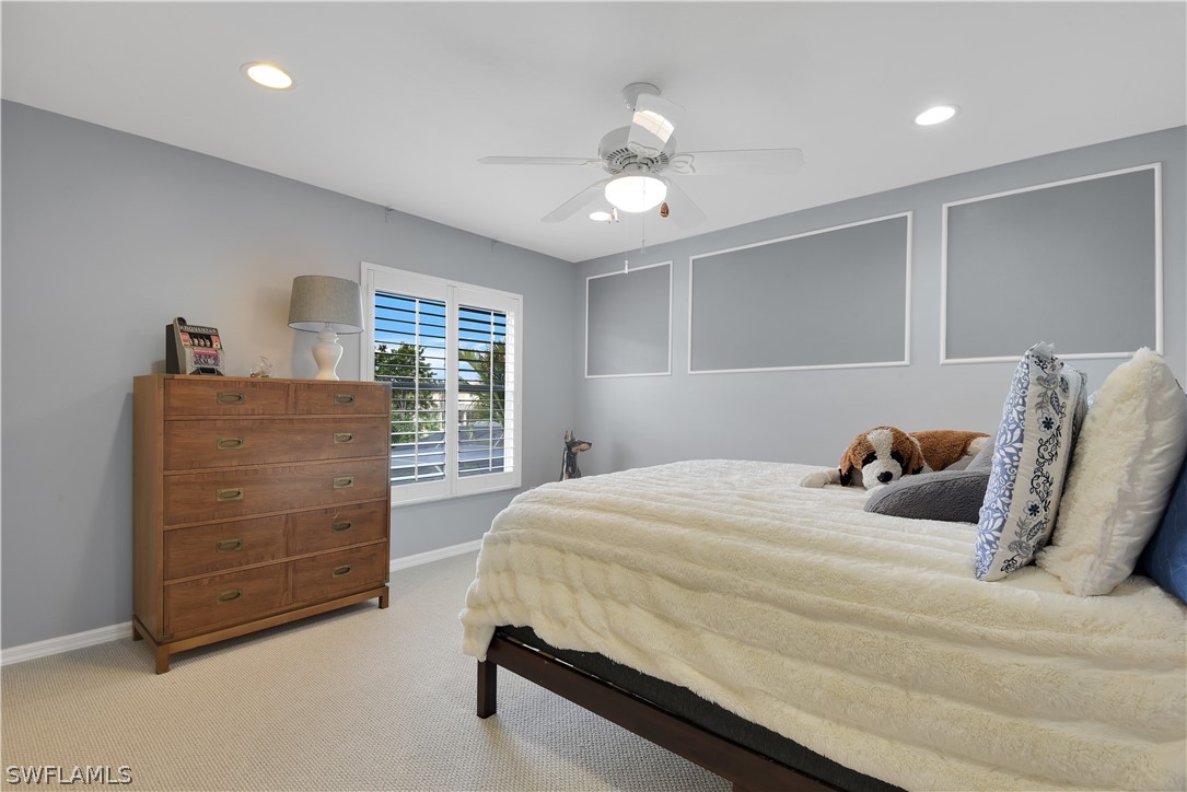 12834 Timber Ridge Drive Fort Myers, FL 33913 - Photo 18 of 31 a bedroom with a bed and a dresser