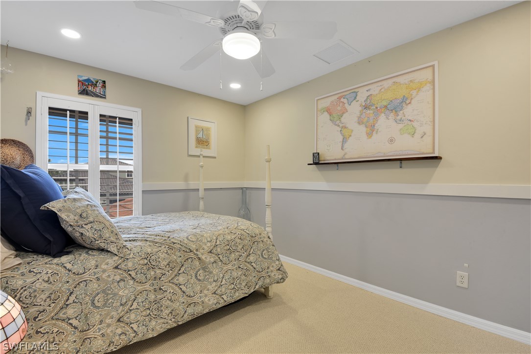 12834 Timber Ridge Drive Fort Myers, FL 33913 - Photo 23 of 31 a bedroom with a bed and wooden floor