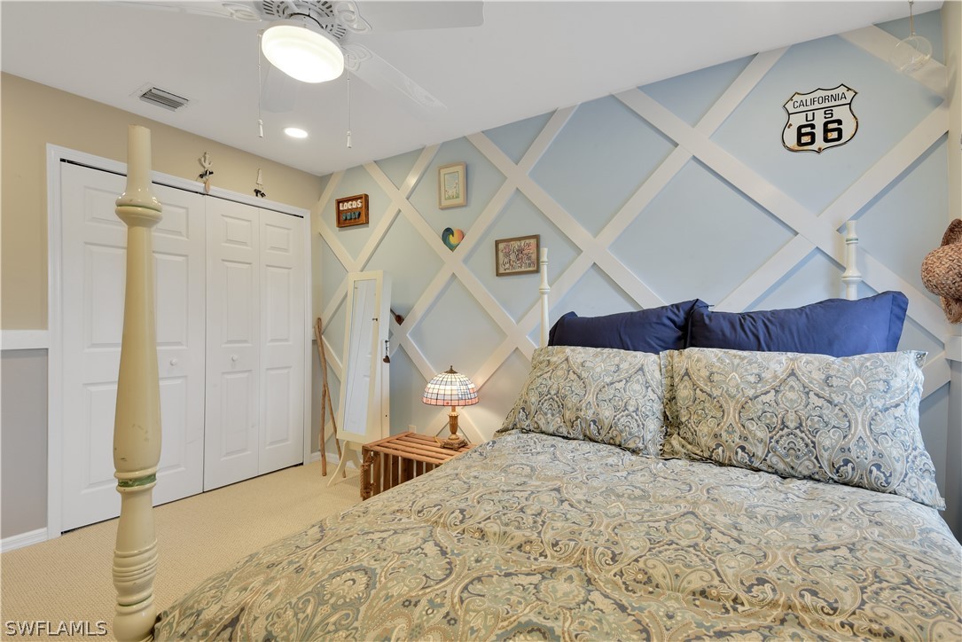 12834 Timber Ridge Drive Fort Myers, FL 33913 - Photo 24 of 31 a bedroom with a bed and a window