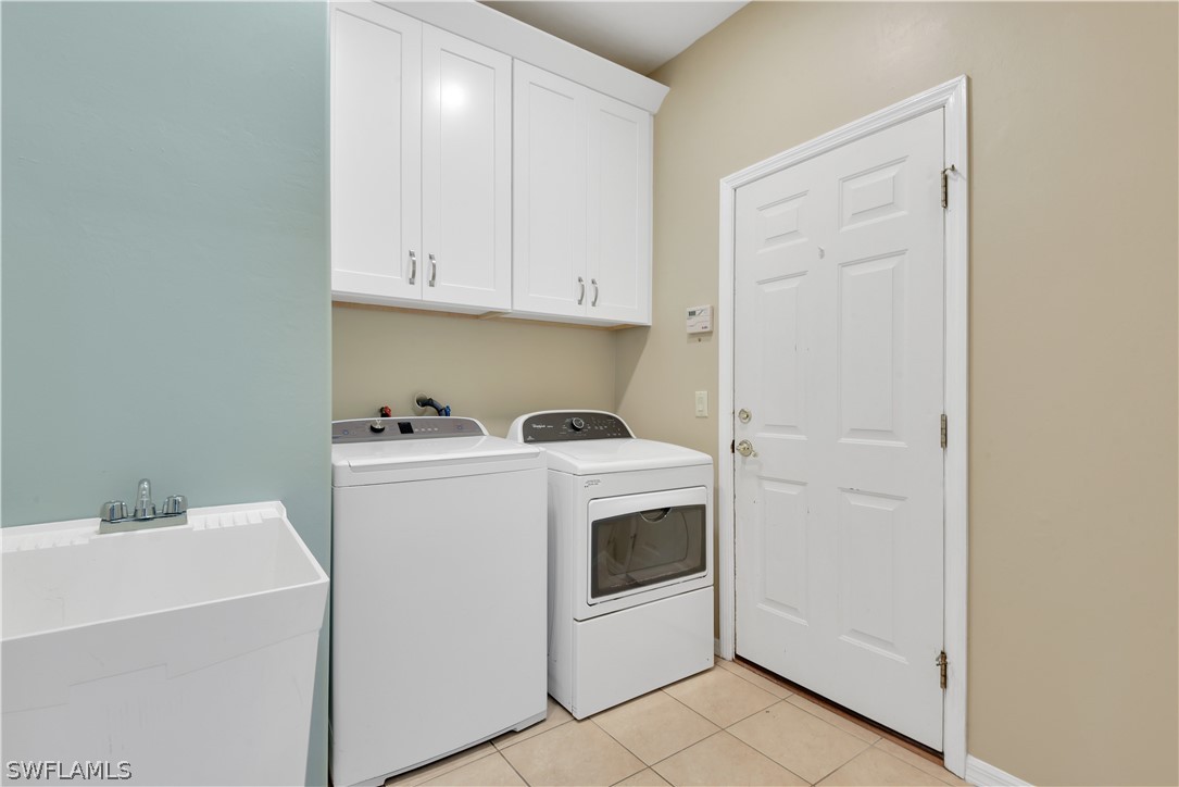 12834 Timber Ridge Drive Fort Myers, FL 33913 - Photo 28 of 31 a utility room with dryer and washer