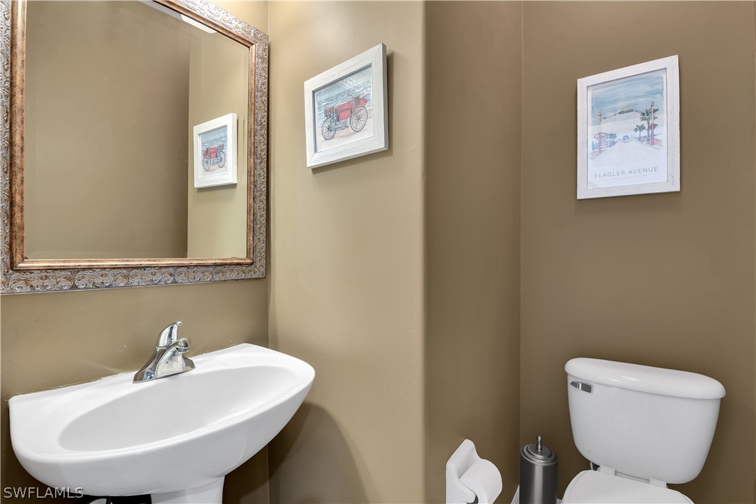 12834 Timber Ridge Drive Fort Myers, FL 33913 - Photo 29 of 31 a bathroom with a toilet and sink