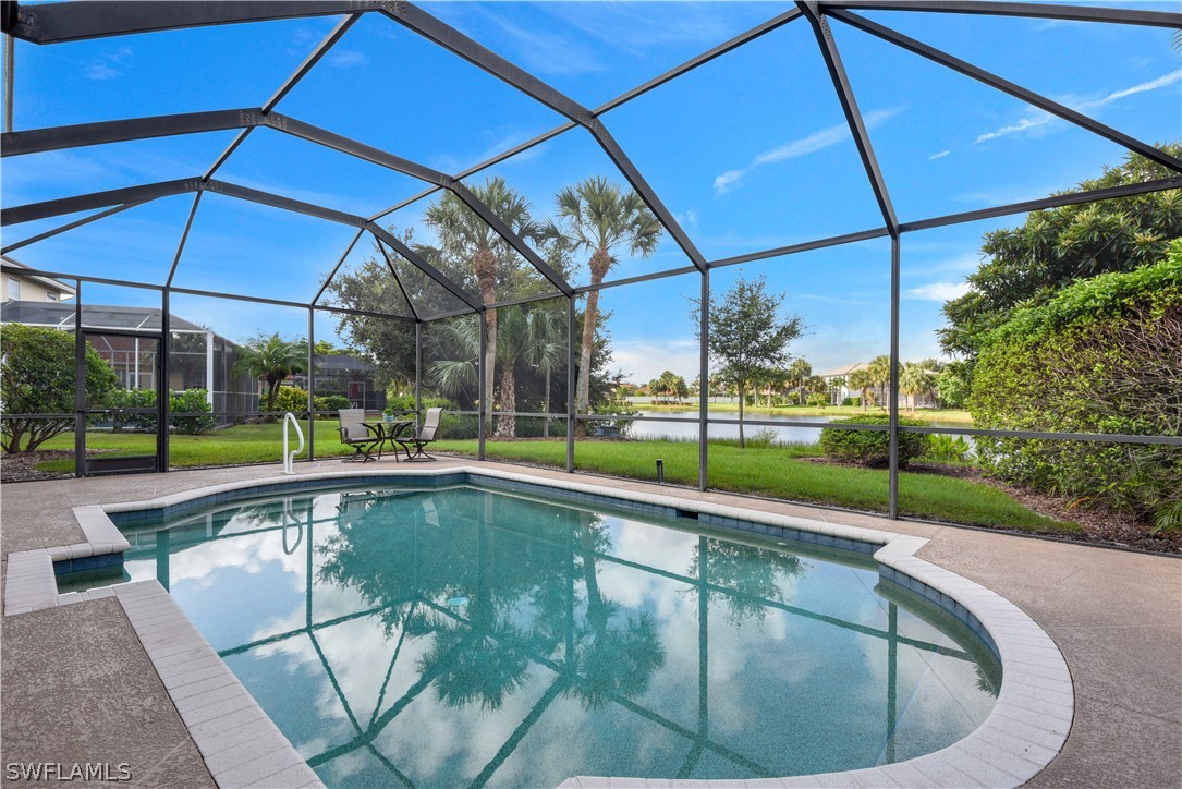 12834 Timber Ridge Drive Fort Myers, FL 33913 - Photo 3 of 31 a view of a swimming pool with a porch