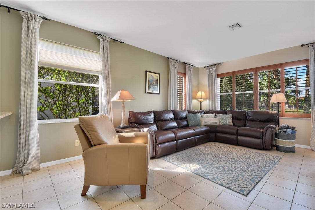 12834 Timber Ridge Drive Fort Myers, FL 33913 - Photo 6 of 31 a living room with furniture and a large window
