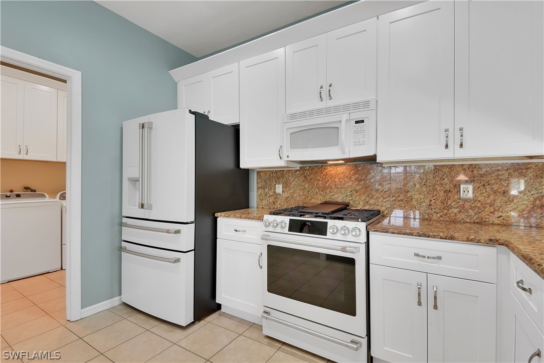 12834 Timber Ridge Drive Fort Myers, FL 33913 - Photo 8 of 31 a kitchen with cabinets and appliances