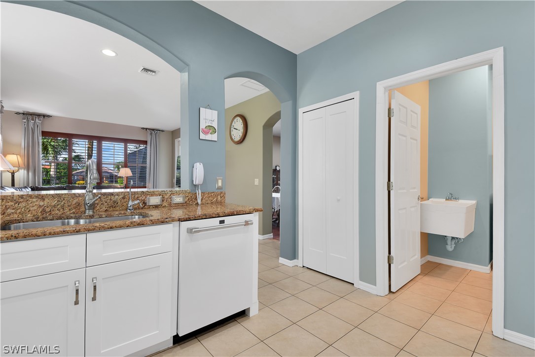 12834 Timber Ridge Drive Fort Myers, FL 33913 - Photo 9 of 31 a spacious bathroom with a granite countertop sink and a mirror