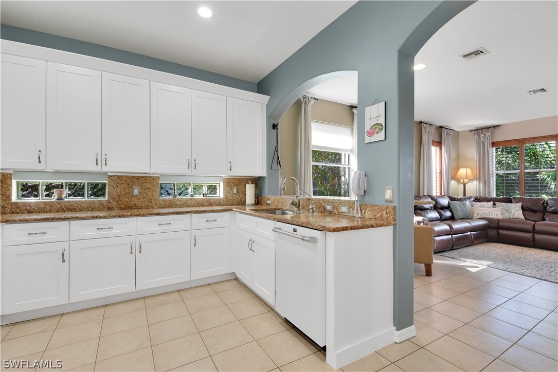 12834 Timber Ridge Drive Fort Myers, FL 33913 - Photo 10 of 31 a kitchen with a sink and cabinets