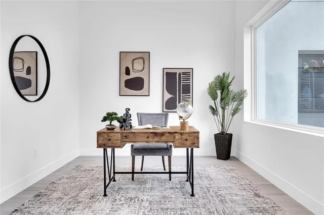 a workspace with furniture and a potted plant