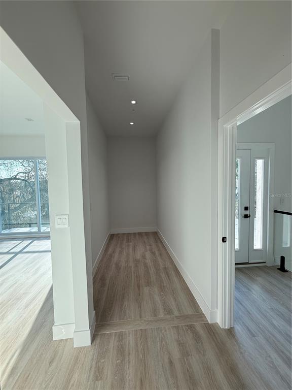 436 East 7th Avenue Windermere, FL 34786 - Photo 16 of 29 wooden floor in an empty room with a window