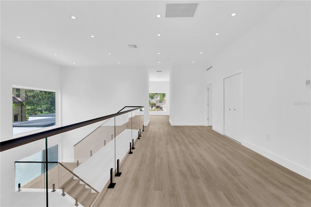 436 East 7th Avenue Windermere, FL 34786 - Photo 17 of 27 a view of entryway with wooden floor