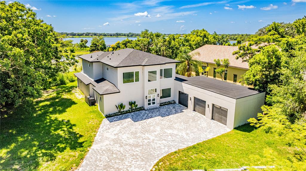 436 East 7th Avenue Windermere, FL 34786 - Photo 2 of 27 a front view of a house with a yard