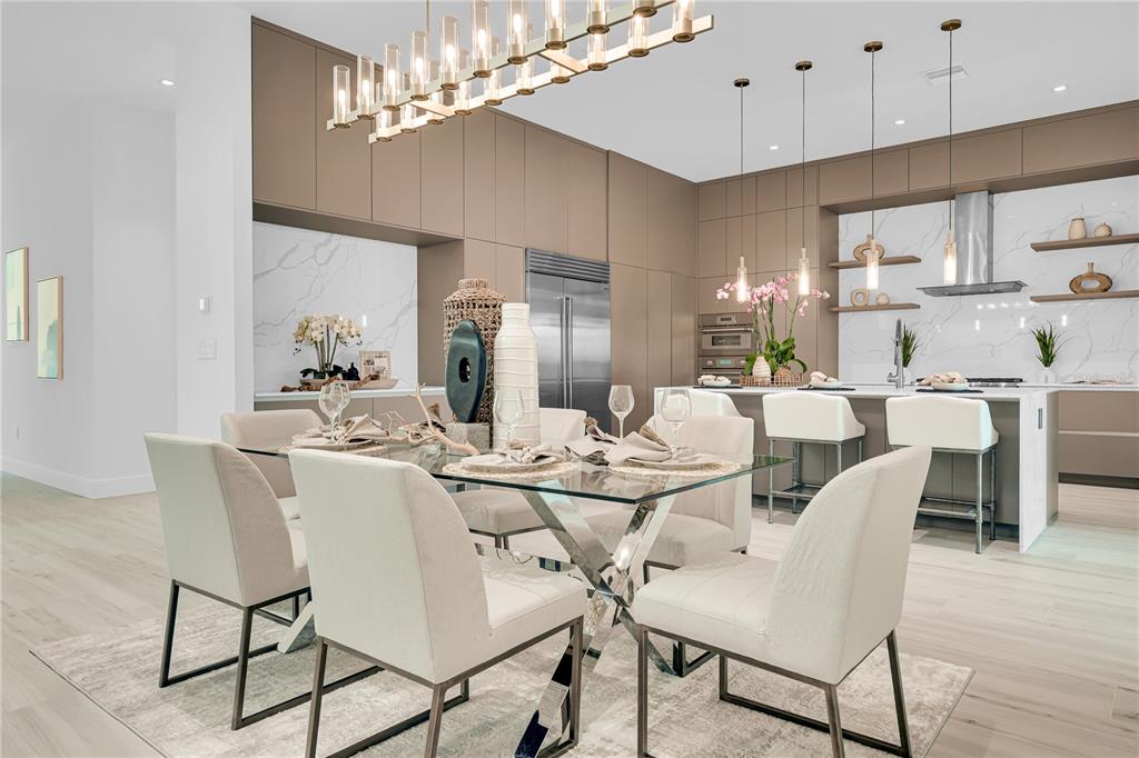 436 East 7th Avenue Windermere, FL 34786 - Photo 6 of 27 a view of a dining room with furniture a chandelier and wooden floor