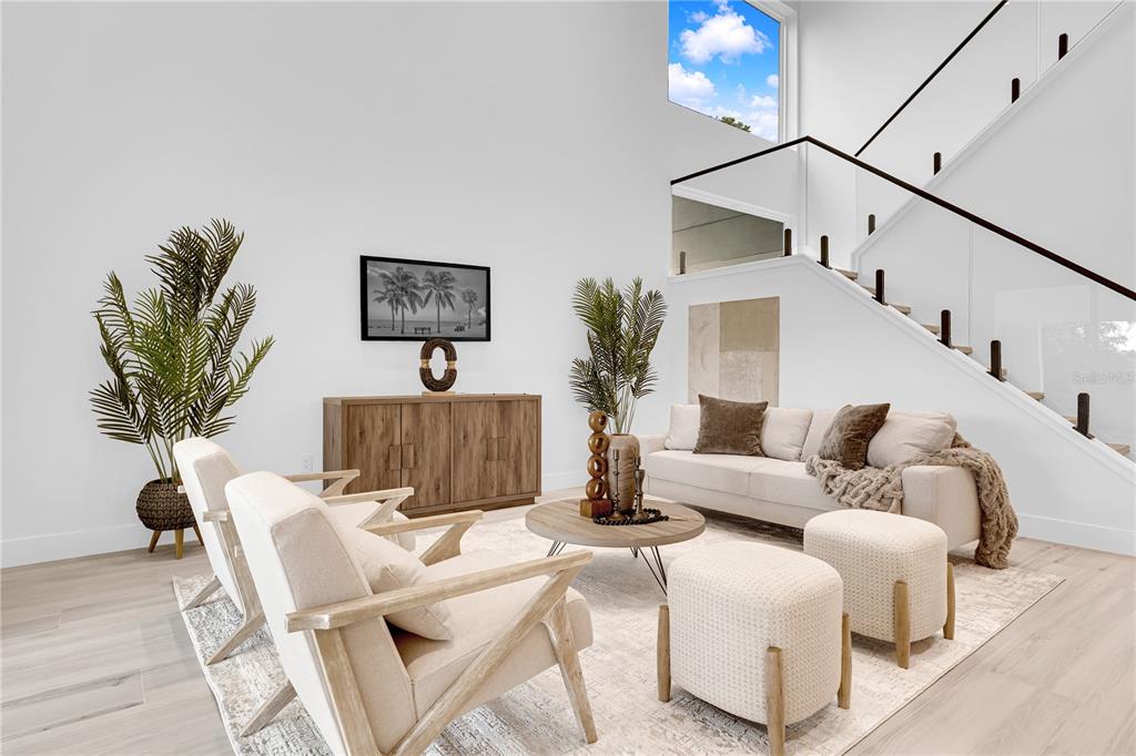 436 East 7th Avenue Windermere, FL 34786 - Photo 7 of 27 a living room with furniture a potted plant and a lamp