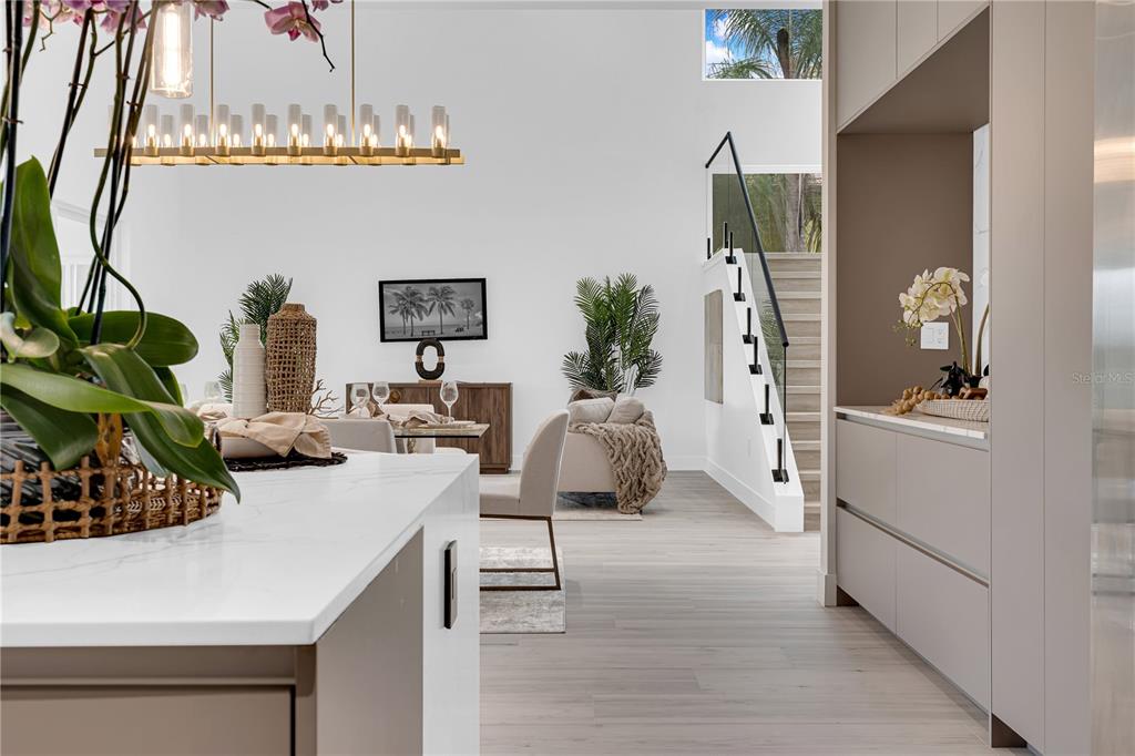 436 East 7th Avenue Windermere, FL 34786 - Photo 9 of 27 a living room with furniture and a chandelier