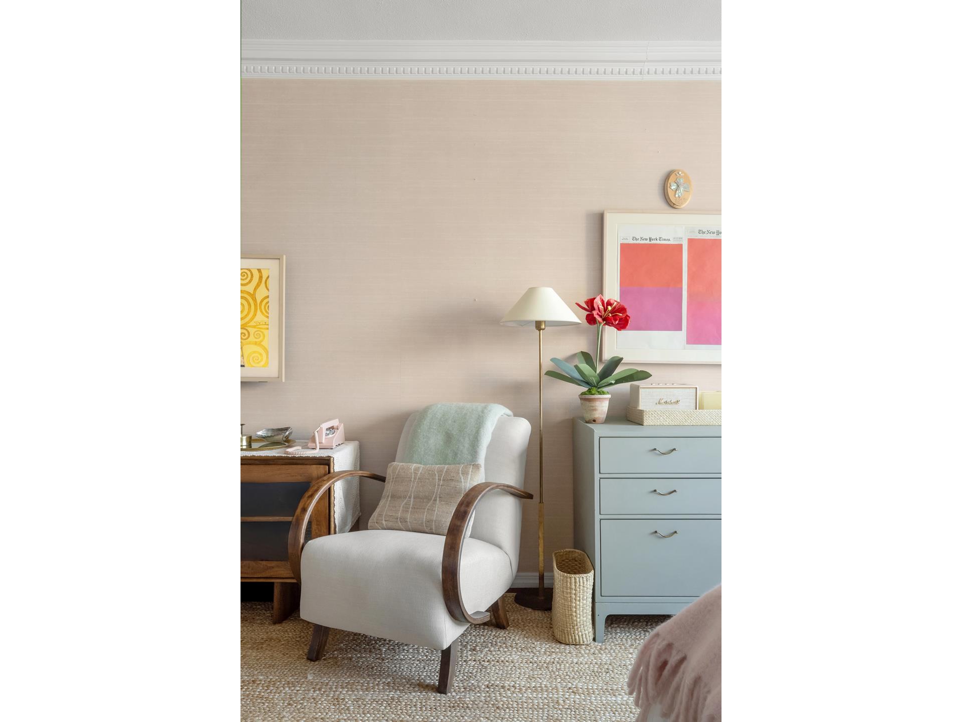101 West 12th Street, Unit 12E Manhattan, NY 10011 - Photo 2 of 9 a living room with furniture and a potted plant