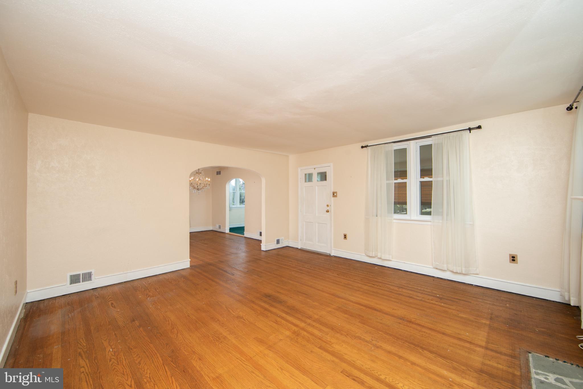 449 Hawarden Road Springfield, PA 19064 - Photo 13 of 60 Spacious, sunlit living area awaits your touch.