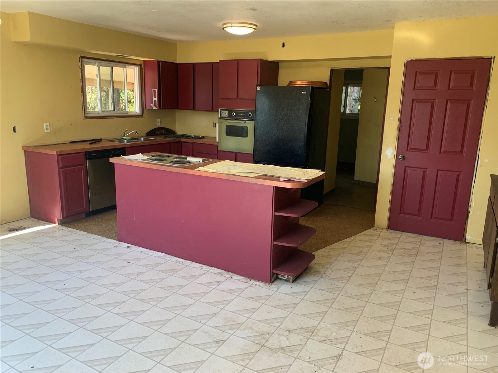 3037 Massey Road Everson, WA 98247 - Photo 8 of 28 a kitchen with stainless steel appliances granite countertop a refrigerator a sink and wooden cabinets
