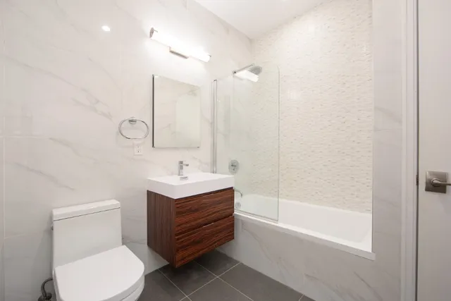 a bathroom with a toilet a sink and a bathtub