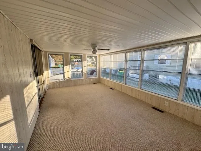 a view of an empty room with a fireplace