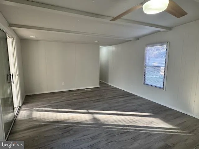 a view of room with wooden floor