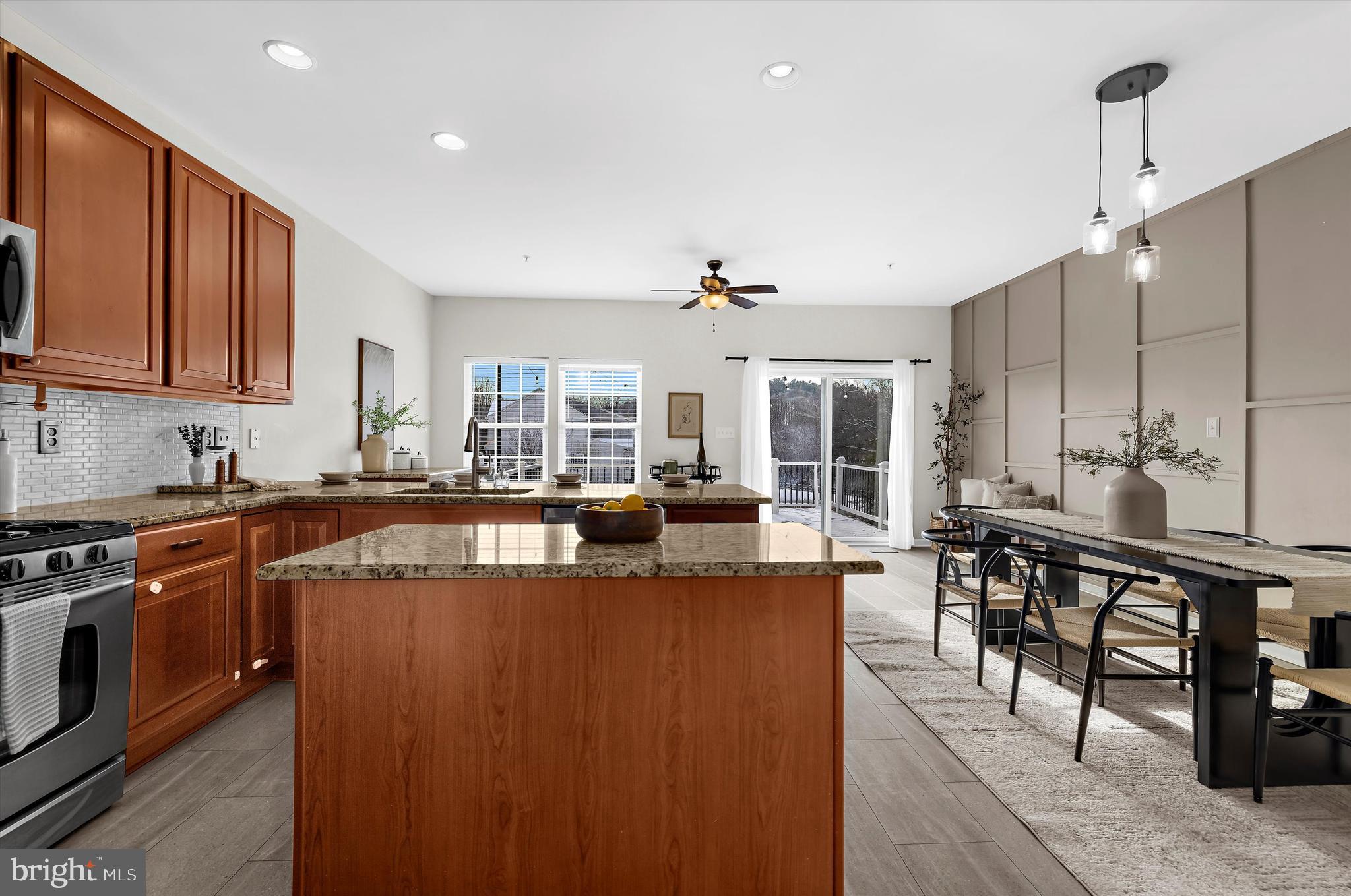 3115 Raking Leaf Drive Abingdon, MD 21009 - Photo 11 of 61 a view of a kitchen with kitchen island a large counter top space a sink stainless steel appliances and cabinets