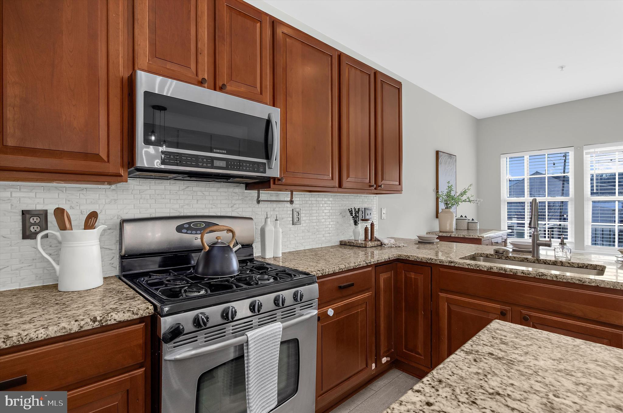 3115 Raking Leaf Drive Abingdon, MD 21009 - Photo 14 of 61 a kitchen with a sink stove and microwave