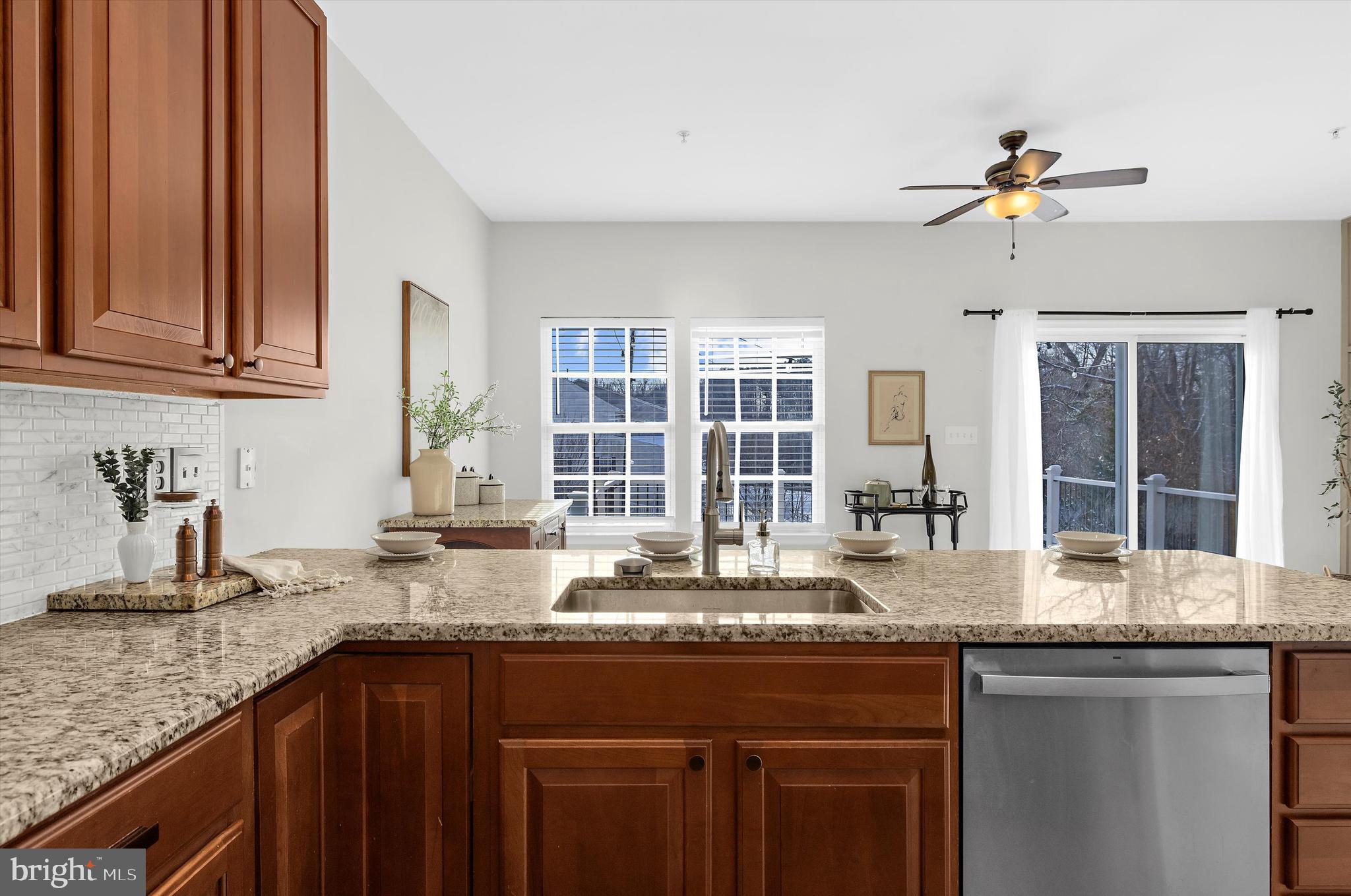 3115 Raking Leaf Drive Abingdon, MD 21009 - Photo 15 of 61 a kitchen with granite countertop a sink stainless steel appliances and a counter space