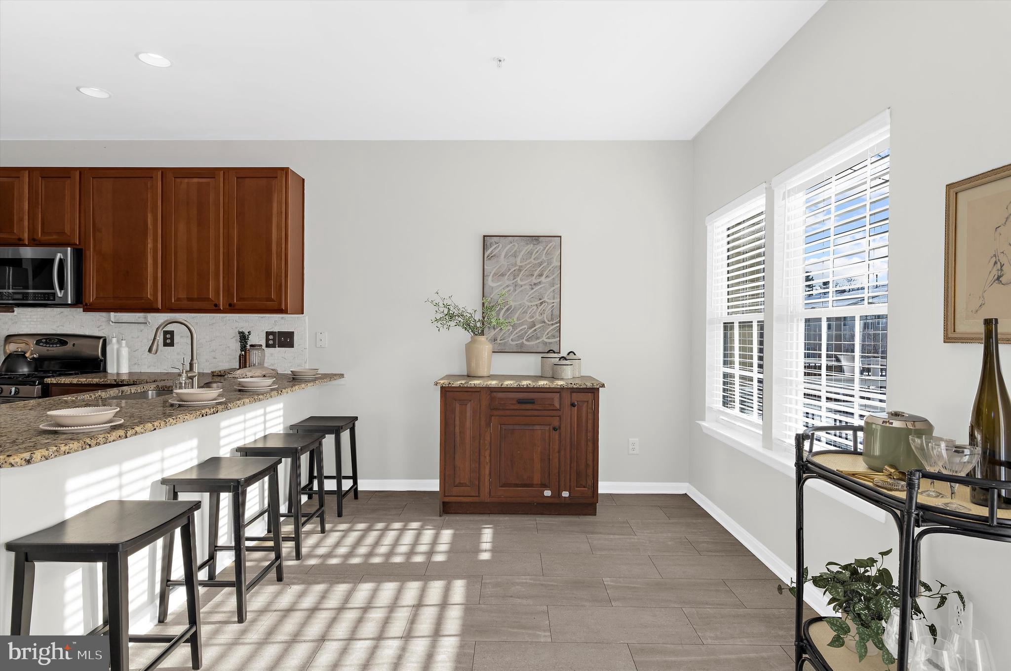 3115 Raking Leaf Drive Abingdon, MD 21009 - Photo 18 of 61 a view of a kitchen with a dining table and chairs