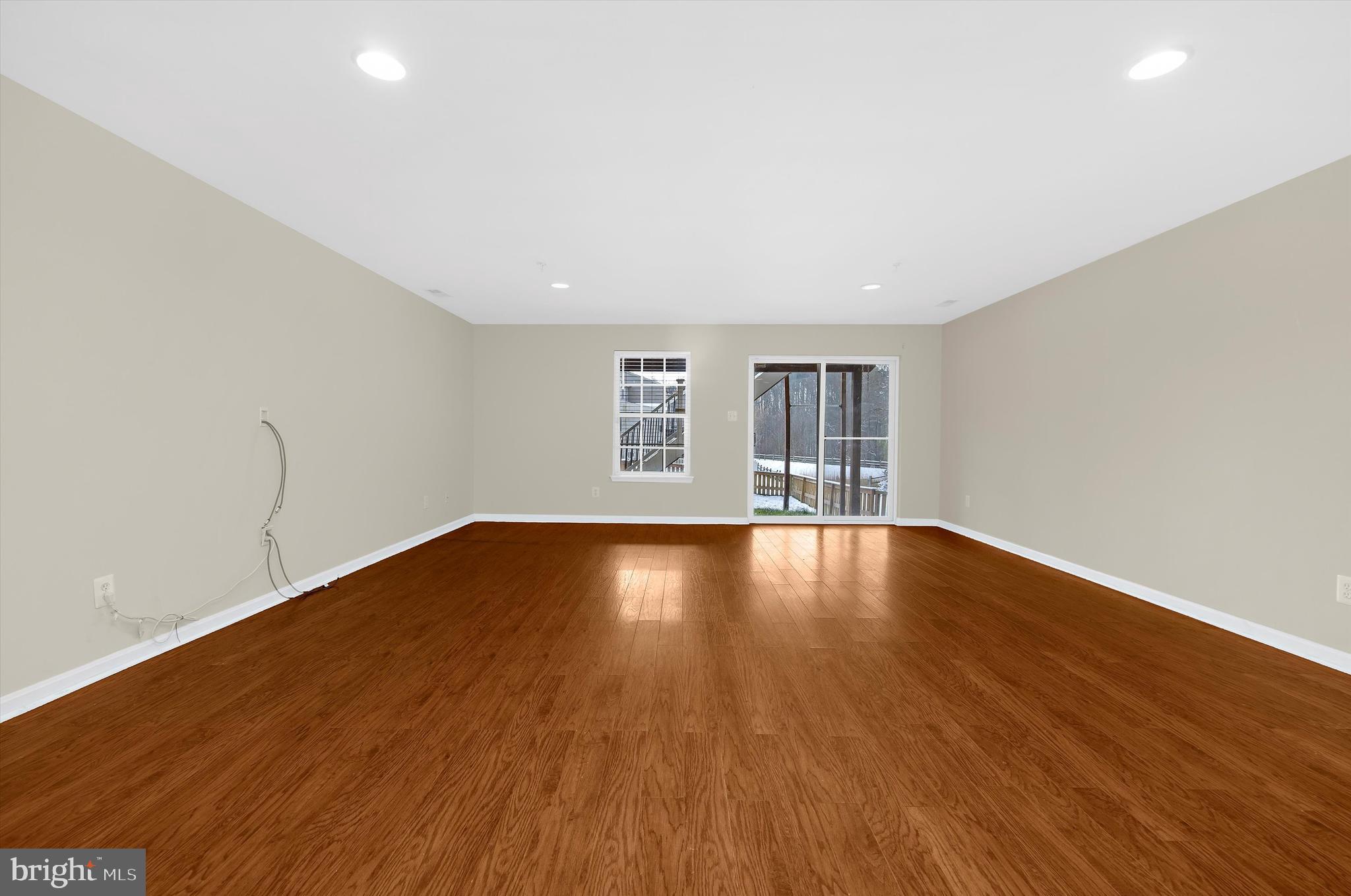 3115 Raking Leaf Drive Abingdon, MD 21009 - Photo 21 of 61 an empty room with wooden floor and windows
