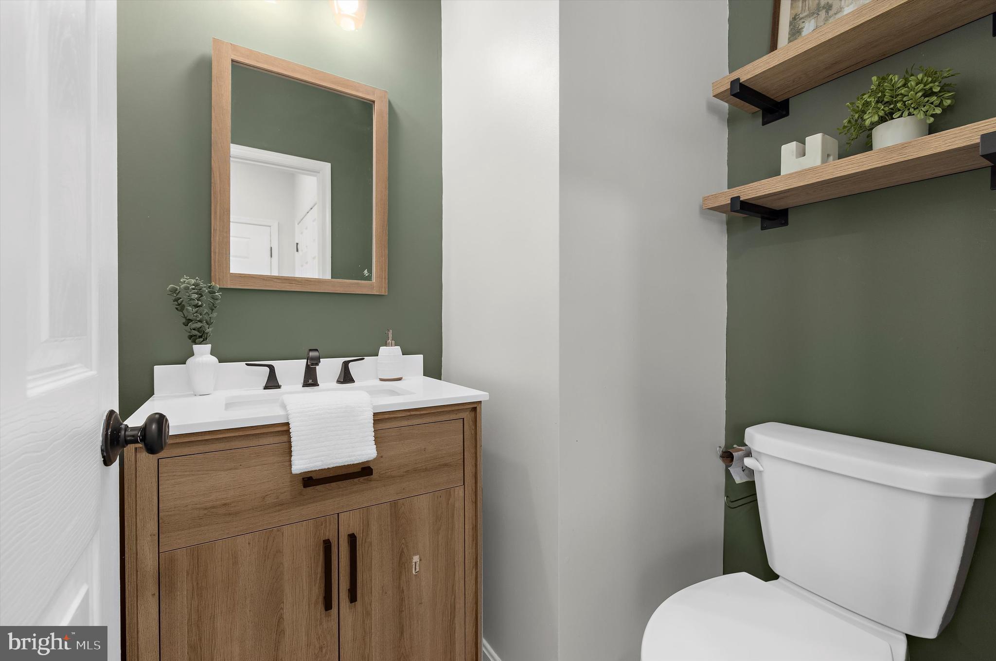 3115 Raking Leaf Drive Abingdon, MD 21009 - Photo 6 of 61 a white toilet sitting next to a bathroom sink