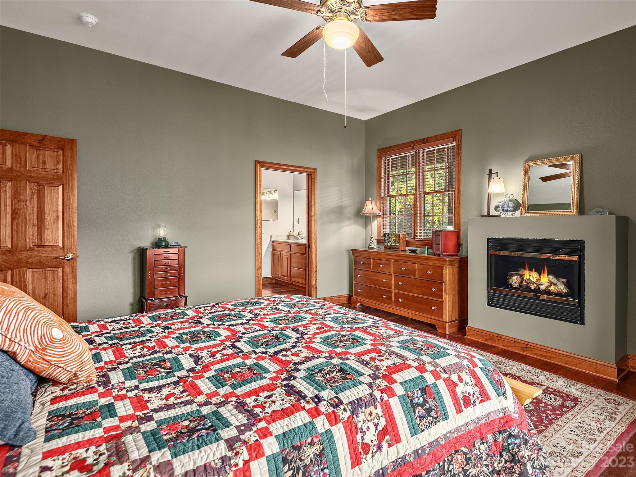 234 Arbor Ridge Clyde, NC 28721 - Photo 11 of 33 a bedroom with a bed and a fireplace