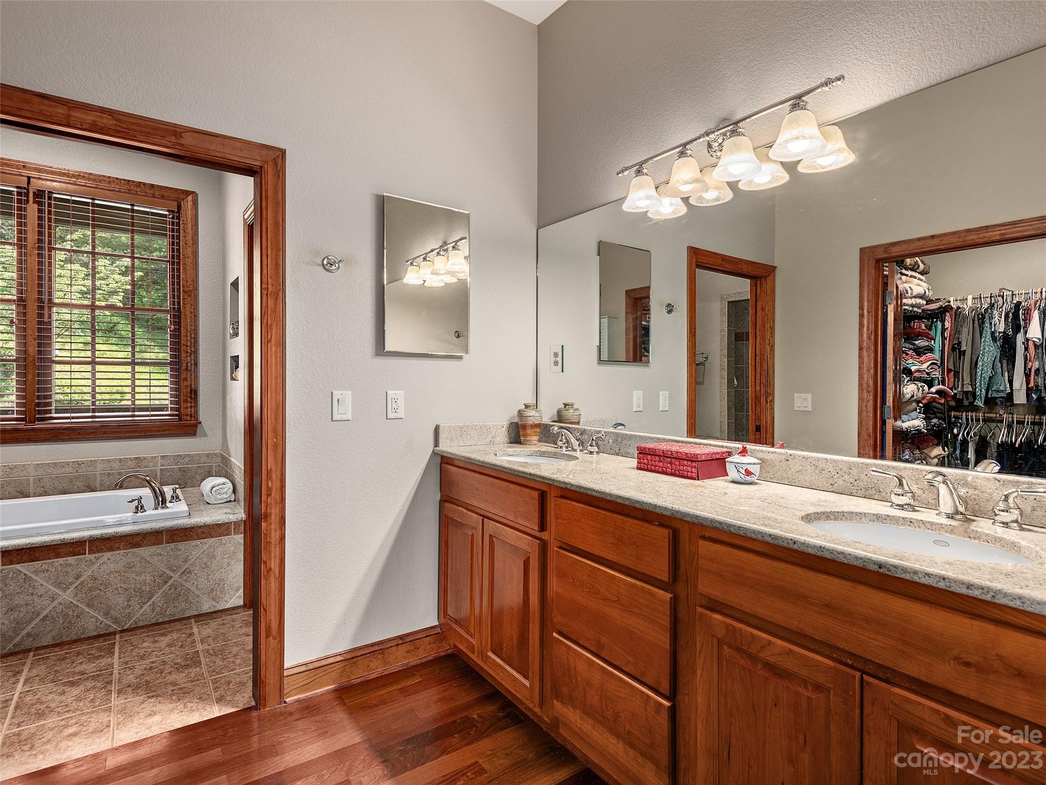 234 Arbor Ridge Clyde, NC 28721 - Photo 12 of 33 a bathroom with a sink double vanity granite and a mirror