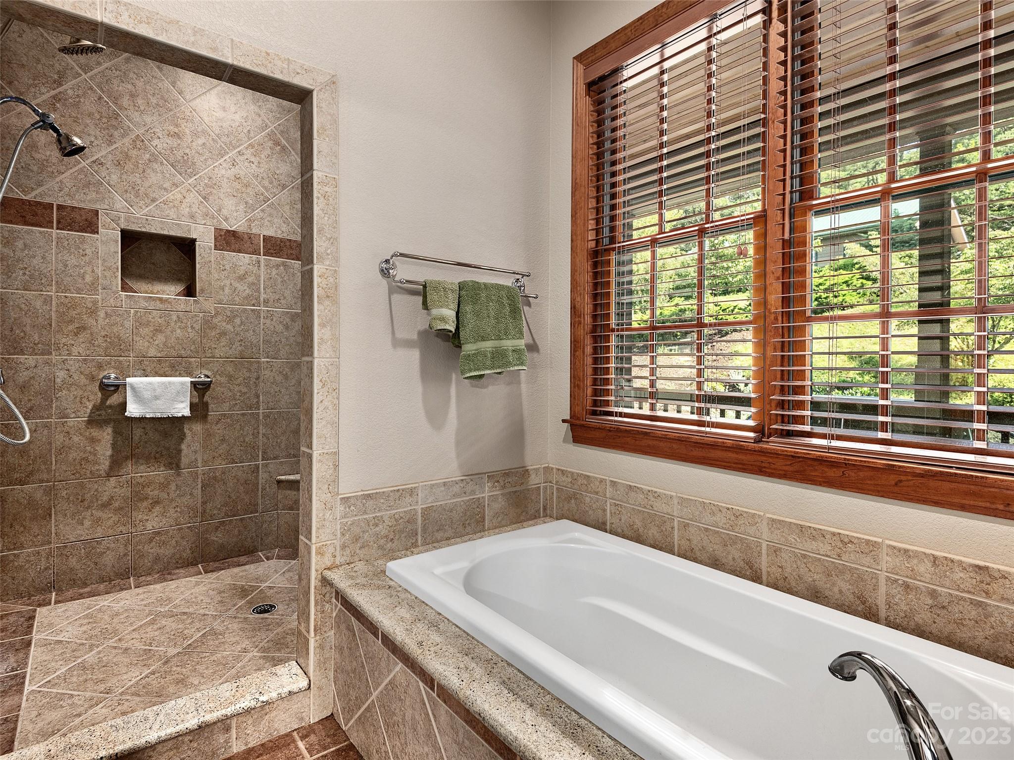 234 Arbor Ridge Clyde, NC 28721 - Photo 13 of 33 a bath tub sitting next to a window