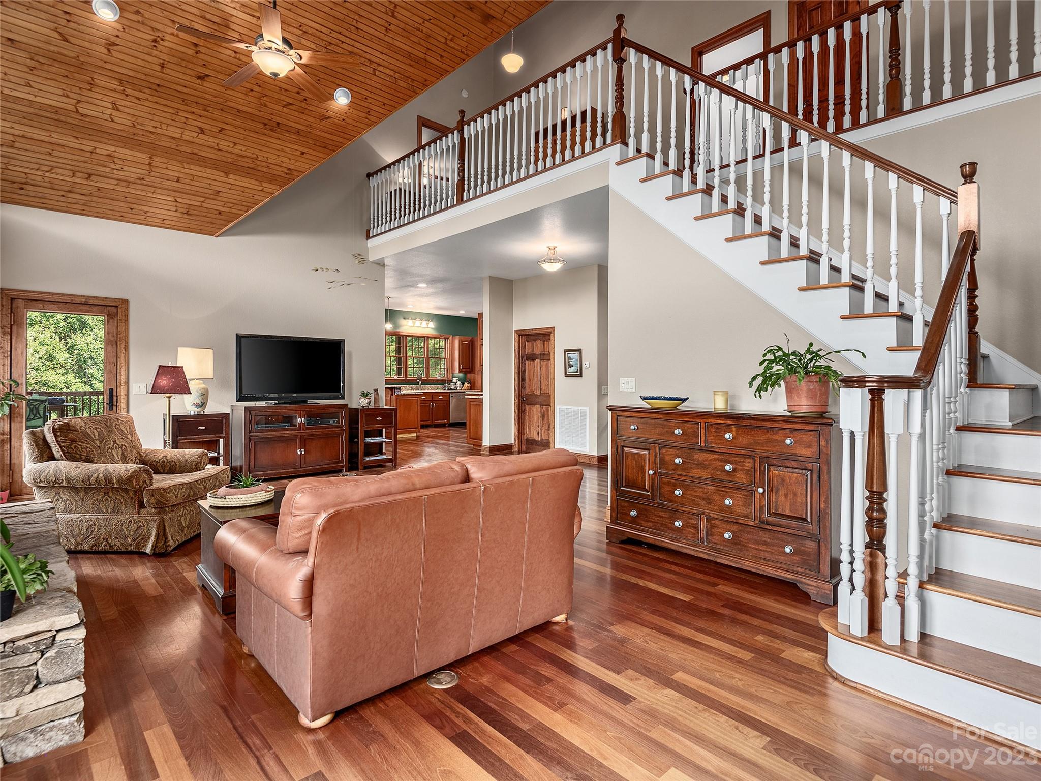 234 Arbor Ridge Clyde, NC 28721 - Photo 17 of 33 a living room with furniture and a flat screen tv