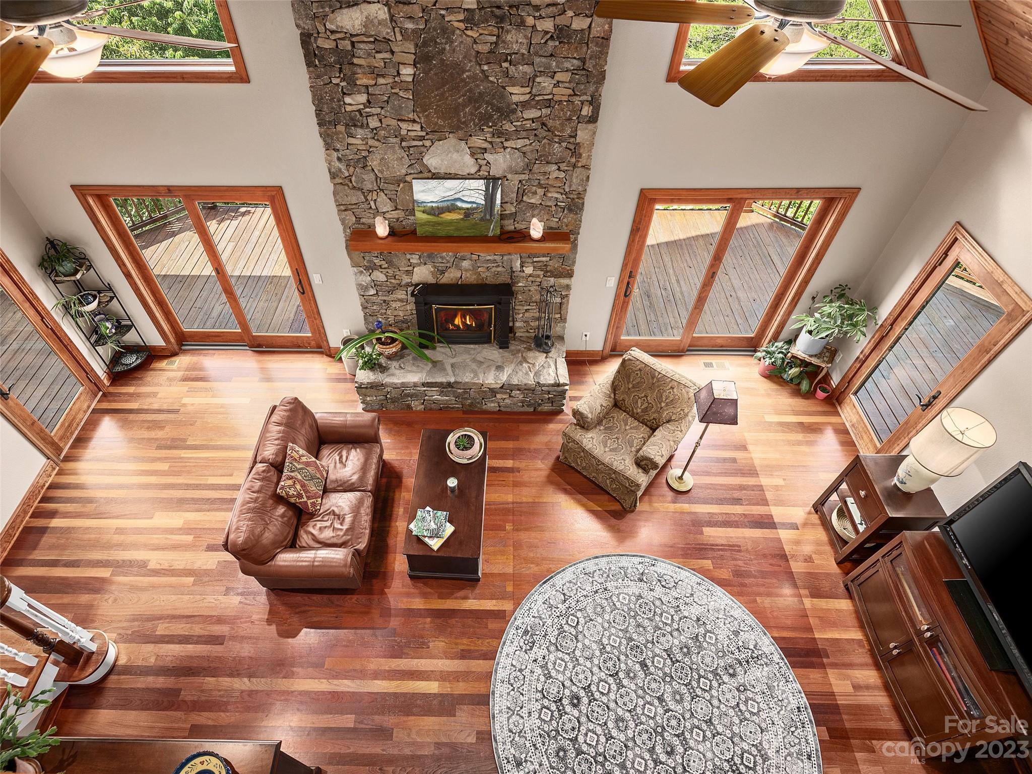 234 Arbor Ridge Clyde, NC 28721 - Photo 18 of 33 a living room with furniture and a fireplace