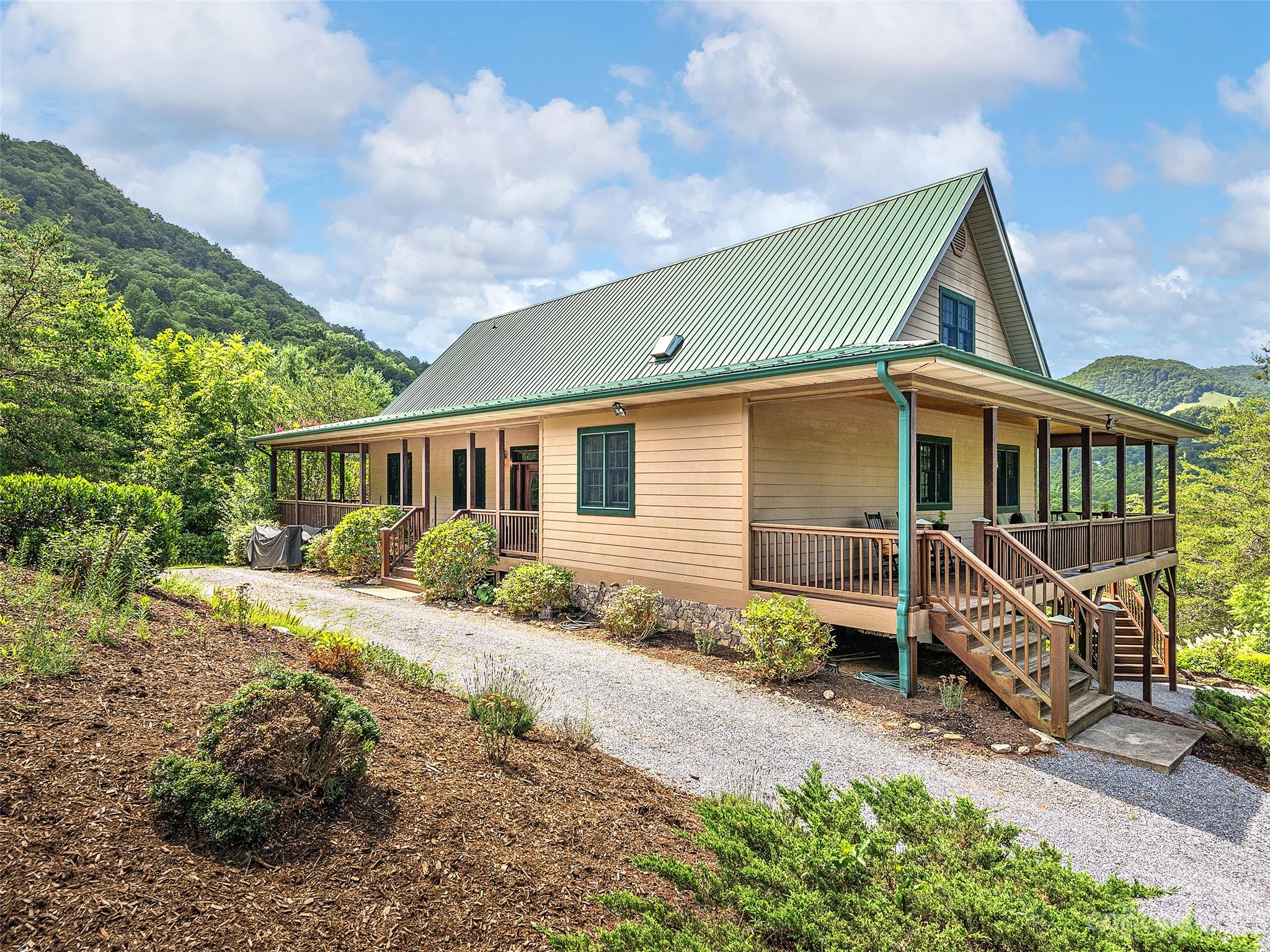 234 Arbor Ridge Clyde, NC 28721 - Photo 2 of 33 a view of a house with backyard and sitting area