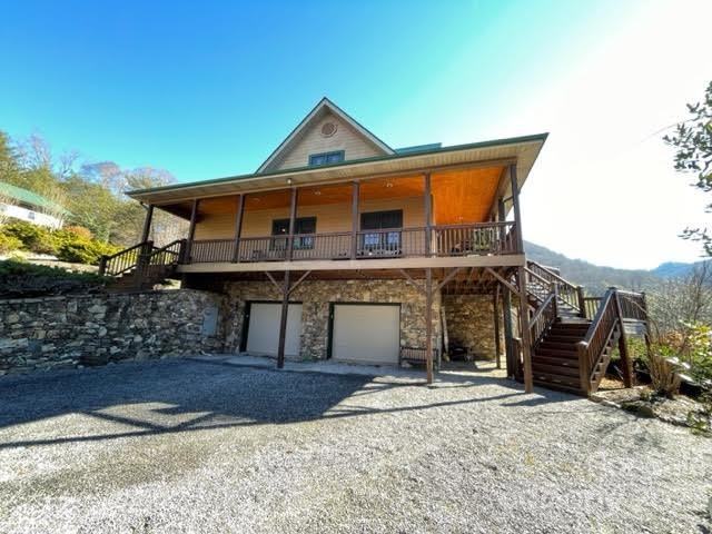 234 Arbor Ridge Clyde, NC 28721 - Photo 23 of 33 a front view of a house with a yard