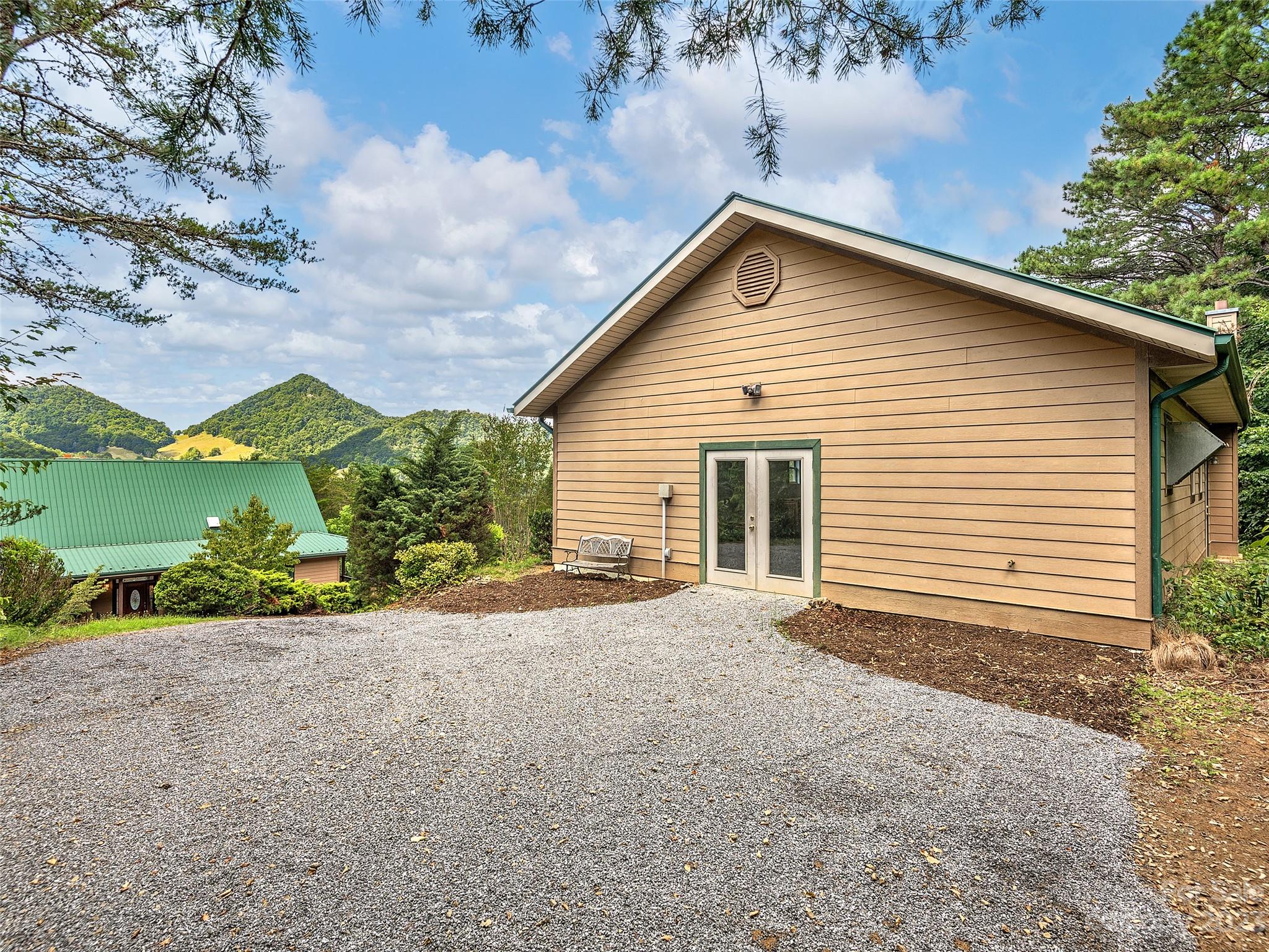 234 Arbor Ridge Clyde, NC 28721 - Photo 24 of 33 a view of a house with a yard and garage