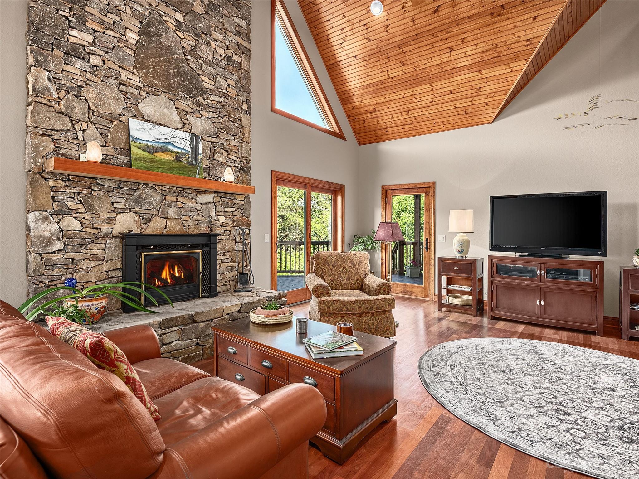 234 Arbor Ridge Clyde, NC 28721 - Photo 4 of 33 a living room with furniture and a flat screen tv