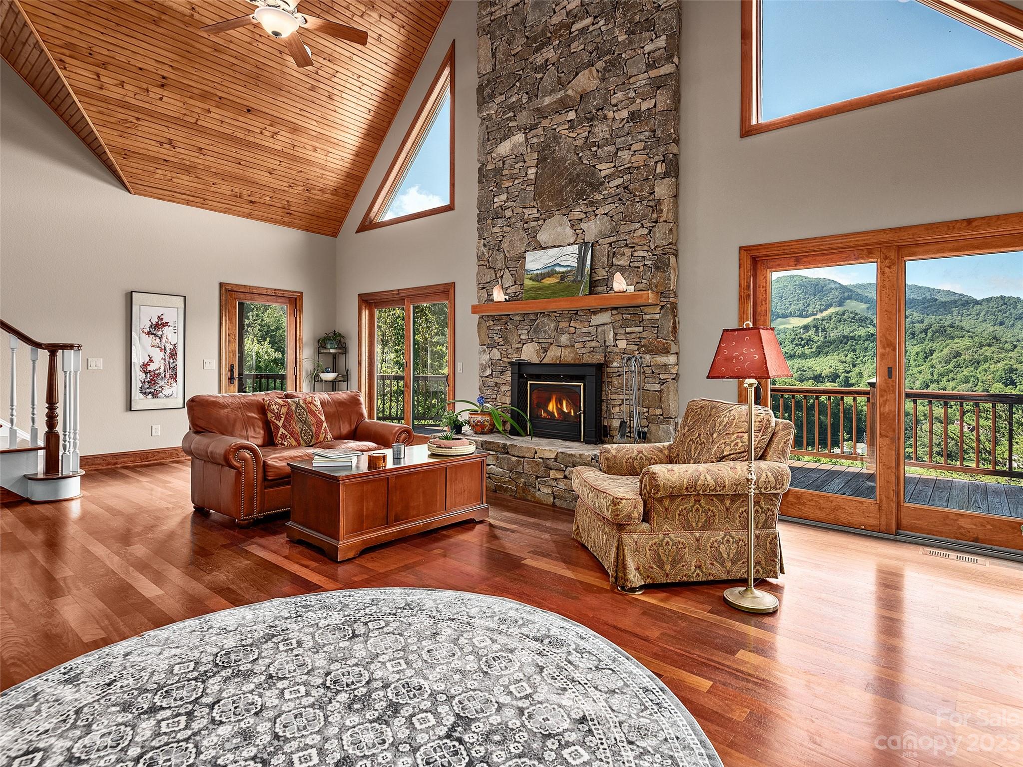 234 Arbor Ridge Clyde, NC 28721 - Photo 6 of 33 a living room with furniture and a fireplace