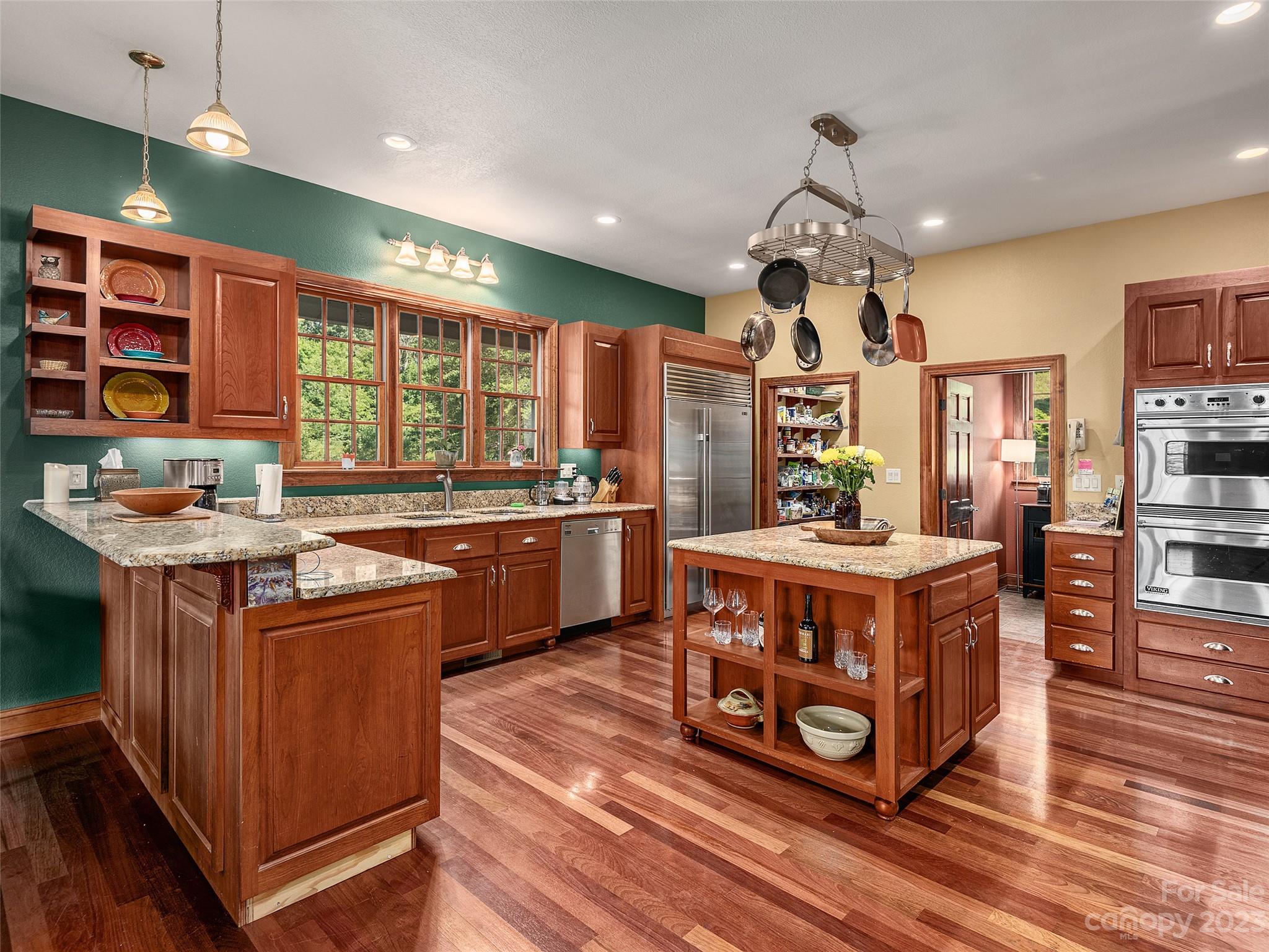 234 Arbor Ridge Clyde, NC 28721 - Photo 7 of 33 a kitchen with stainless steel appliances granite countertop a stove and a large cabinets